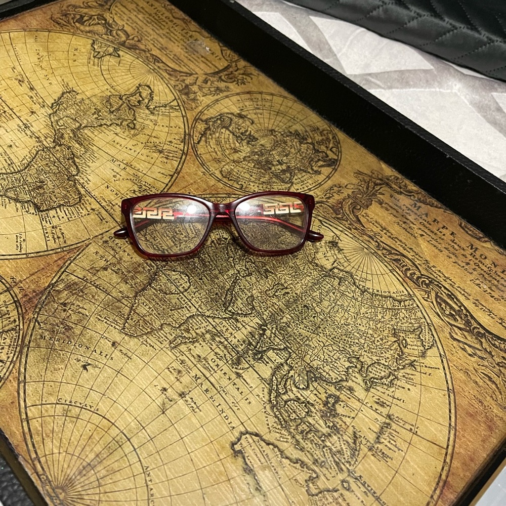 Authentic red Versace eyeglasses never worn still has the retail lenses in.